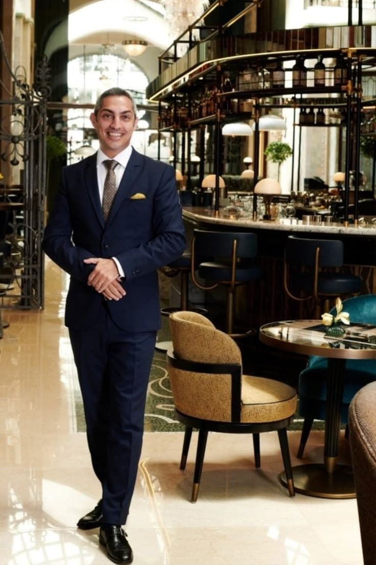 Hotel manager in a tailored Brada Uniforms suit